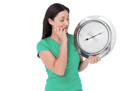 brunette woman anxiously holding transparent wall clock - Download Free Stock Videos Pikwizard.com
