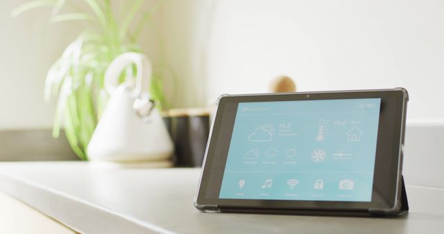 Image of tablet with smart home interface screen on worktop in sunny, modern kitchen - Download Free Stock Photos Pikwizard.com
