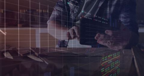 Business Professional Analyzing Stock Data on Tablet with Graph Overlay