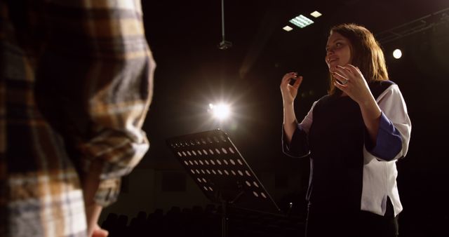 Choir Conductor Leading Rehearsal in Theater - Download Free Stock Images Pikwizard.com