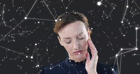 Thoughtful woman gazing downward touching cheek surrounded by glowing network constellation