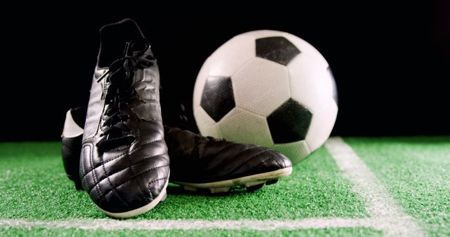 Soccer Cleats and Ball on Turf Field - Download Free Stock Images Pikwizard.com