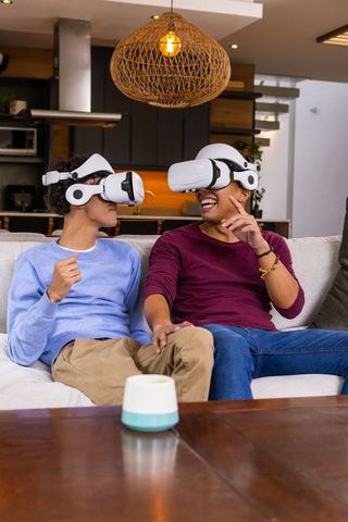 Young Friends Enjoying Virtual Reality in Modern Living Room