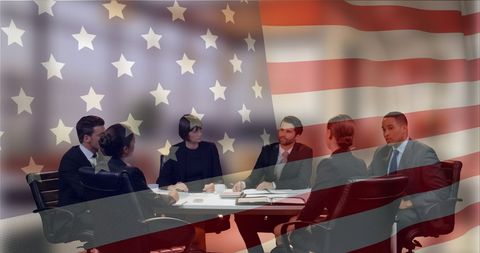 Diverse Business Team Meeting with American Flag Overlay