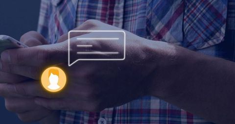 Man tapping smartphone with chat bubble and glowing avatar overlay, closeup of hands