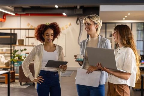 Diverse Professional Women Collaborating in a Modern Office Space