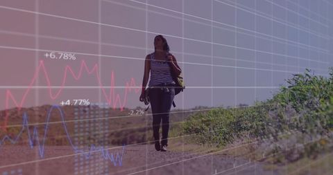 Exploring woman outdoors with chart overlay symbolizing progress