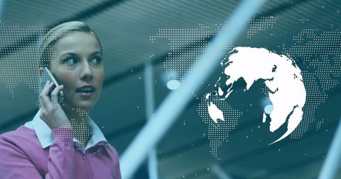 Businesswoman on Phone in Airport with Digital World Map Overlay