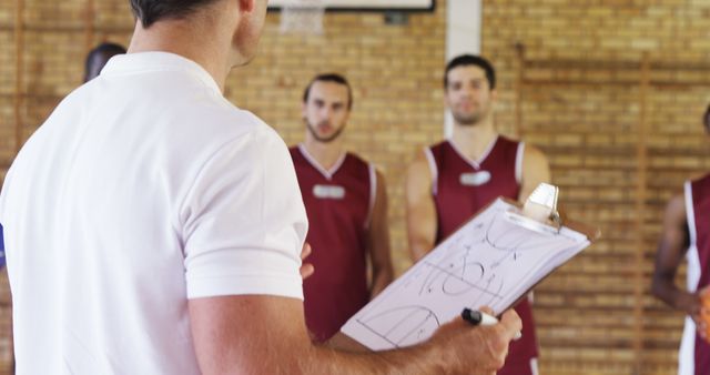 Basketball Team Listening to Coach's Strategy Instructions - Download Free Stock Images Pikwizard.com