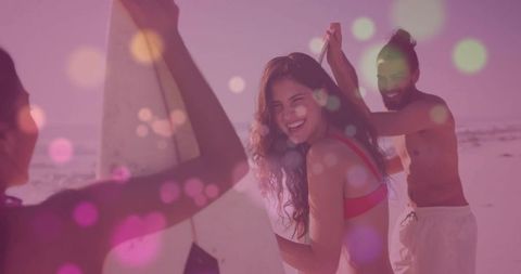Cheerful Beach Fun with Surfers at Sunset