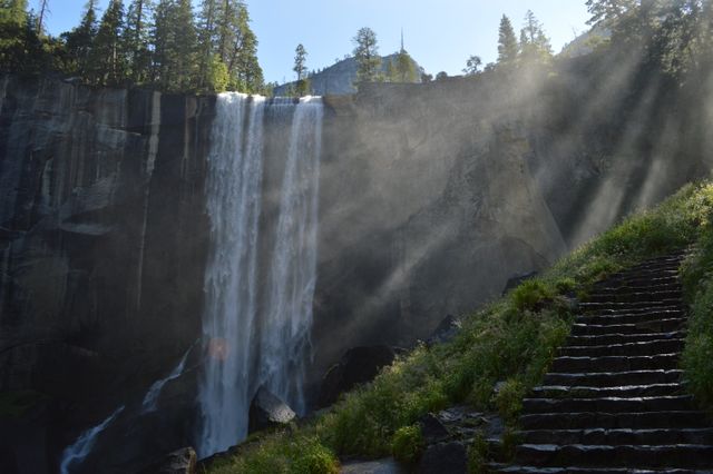 Sunlight Streaming over Majestic Waterfall and Rustic Stone Steps - Download Free Stock Photos Pikwizard.com