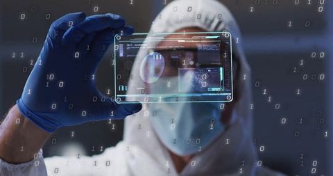 Scientist Analyzing Digital Data in Sterile Environment