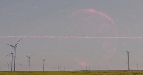 Panoramic wind turbine array on grassland with pink digital halo and desaturated look