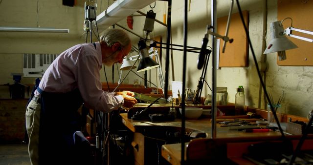 Elderly Man Working in a Workshop - Download Free Stock Images Pikwizard.com