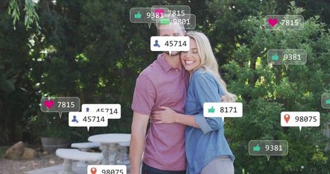 Couple Embracing on Garden Patio with Digital Engagement Icons