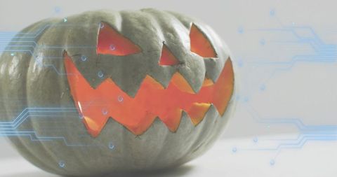 Glowing Jack-O'-Lantern Emitting Warm Light with Futuristic Circuit Overlay