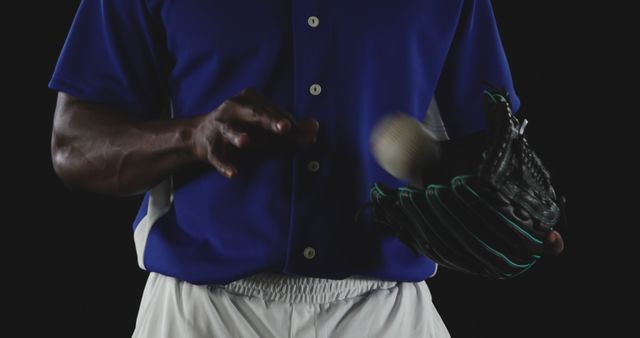 Baseball Player Spinning Ball in Glove in Blue Jersey - Download Free Stock Images Pikwizard.com