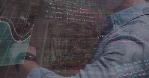 businessman analyzing stock market data on transparent screen projection - Download Free Stock Images Pikwizard.com