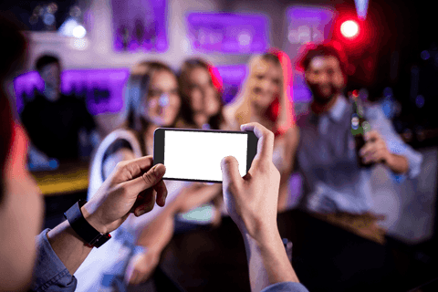 friends capturing moments in bar with transparent phone screen - Download Free Stock Videos Pikwizard.com