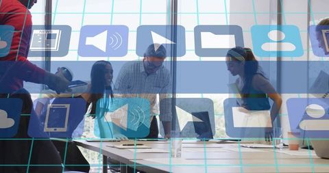 Team collaborating around table in modern office with app icon overlay and digital ui