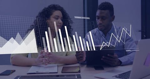 Office Team Analyzing Data Visualizations on Digital Interface