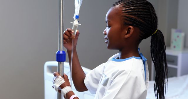 Young African American Girl in Hospital with IV Drip in Hand - Download Free Stock Images Pikwizard.com