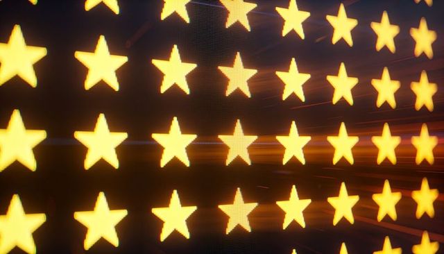 Glowing yellow star grid on led display with motion light streaks and pixel detail