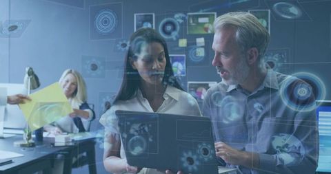 Business Professionals Collaborating with Futuristic Data Interfaces