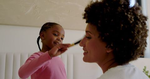 Mother-Daughter Bonding Over Makeup Play at Home