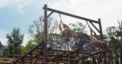 Outdoor Workout: Man Showing Full Body Strength on Monkey Bars - Download Free Stock Images Pikwizard.com