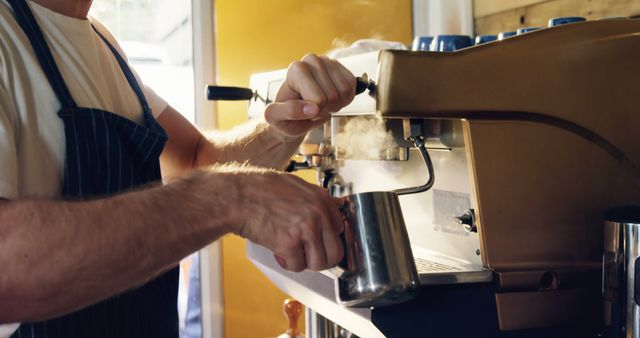 Barista steaming milk with commercial espresso machine at coffee shop - Download Free Stock Images Pikwizard.com