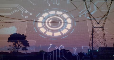 Transmission tower over horizon with digital overlay at dusk