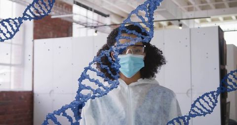 Researcher wearing protective coverall and mask standing in biotech lab with dna overlay