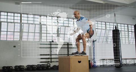 Athlete performing plyometric box jump in industrial gym with futuristic hud overlay