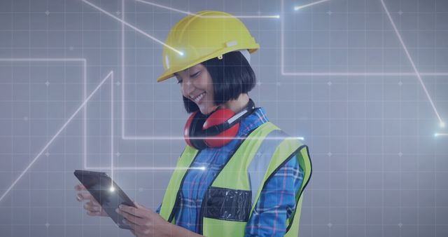 This image portrays a young female engineer engaged in work, exploring digital blueprints on her tablet while wearing a hard hat, safety vest, and headphones. The background features a grid with light connections, signifying technology and innovation. Ideal for use in websites, articles, and advertisements related to construction, engineering services, digital transformation in industry, female professionals in STEM, and safety protocols at workplaces.