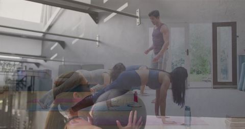 Group Fitness Training Session with Instructor in Modern Pilates Studio