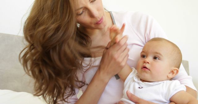 Mother Holding Baby With Love at Home - Download Free Stock Images Pikwizard.com