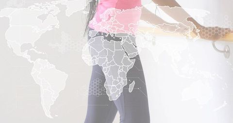 Barre workout leaning woman with world map overlay, global dance and fitness concept