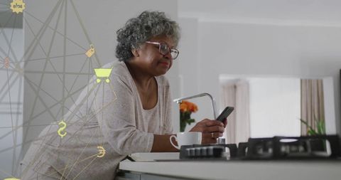 senior woman engaging with technology in modern kitchen - Download Free Stock Images Pikwizard.com