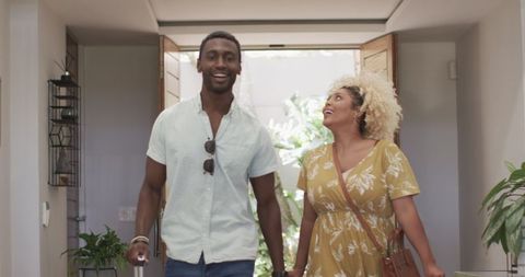 Happy Couple Arriving Home Embracing Togetherness and Joy