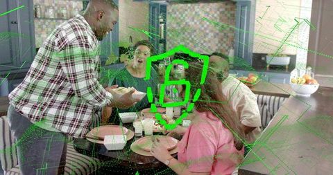 Group sharing meal at modern kitchen roundtable with augmented reality security b overlay