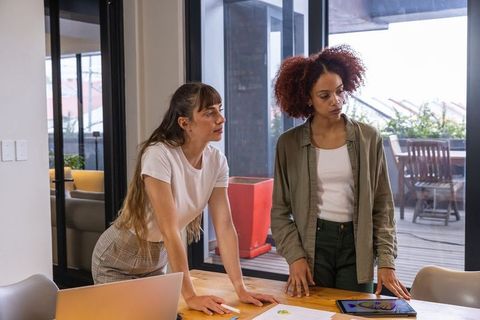 Female professionals collaborating in modern office setup