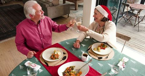 Joyful Senior Couple Celebrating with Holiday Meal