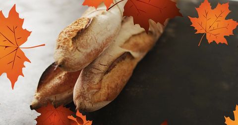 Autumn themed baguettes with falling leaves overlay