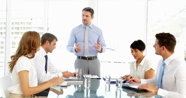Professional Business Meeting in Modern Office with Team Collaboration - Download Free Stock Images Pikwizard.com