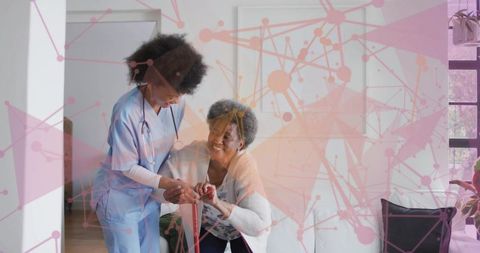 Caregiver assisting senior woman with cane in sunny living room, home nursing and mobility