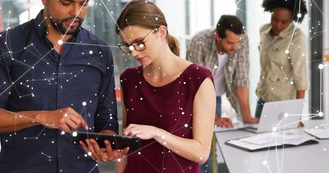 Collaborating on Tablet with Digital Network Overlay in Modern Open Plan Office