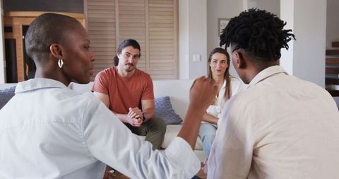 Friends Engaged in Deep Conversation at Home