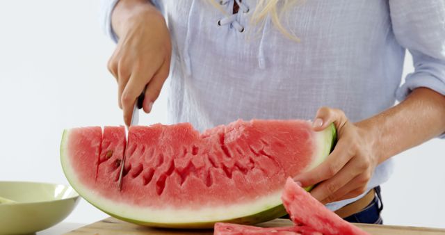 Person Slicing Fresh Watermelon on Cutting Board - Download Free Stock Photos Pikwizard.com