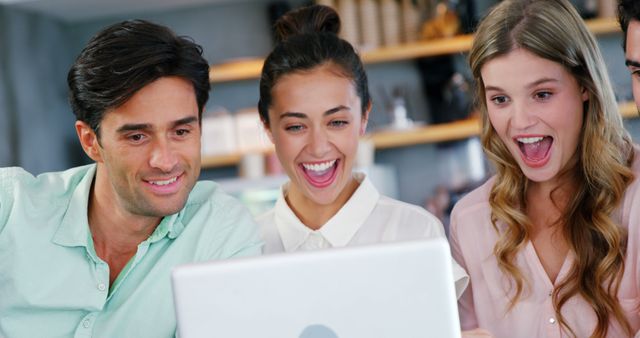 Excited Colleagues Looking at Laptop in Modern Office - Download Free Stock Images Pikwizard.com